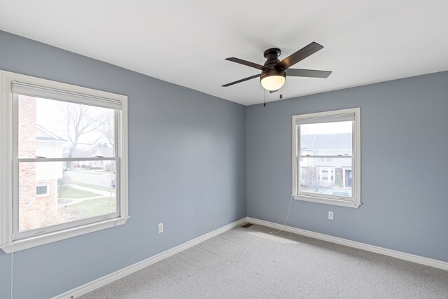 1053 Woodward Hts, Ferndale, MI 48220 - spare room with ceiling fan, light colored carpet, and baseboards