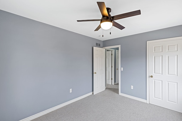 1053 Woodward Hts, Ferndale, MI 48220 - unfurnished bedroom with baseboards, a ceiling fan, visible vents, and carpet floors