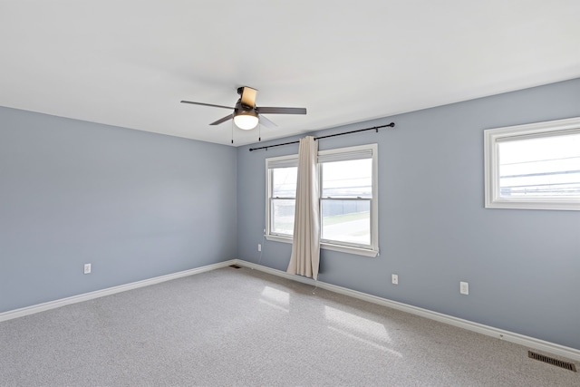 1053 Woodward Hts, Ferndale, MI 48220 - spare room featuring visible vents, ceiling fan, carpet floors, and baseboards