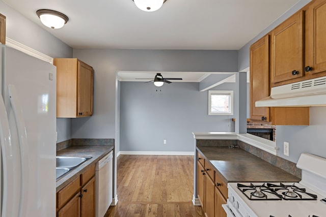 1053 Woodward Hts, Ferndale, MI 48220 - kitchen featuring ceiling fan, white appliances, under cabinet range hood, a sink, and dark countertops