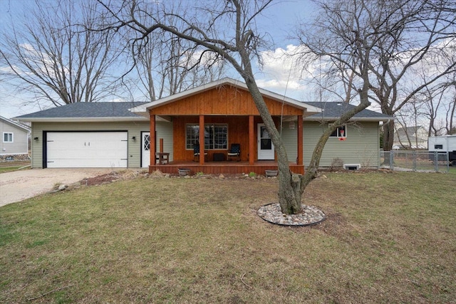 739 Gasper St, Chesaning, MI 48616 - view of front of property featuring a garage, a porch, fence, a front lawn, and driveway