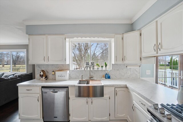 739 Gasper St, Chesaning, MI 48616 - kitchen with decorative backsplash, stainless steel dishwasher, a sink, and white cabinets