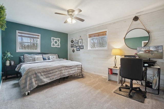 739 Gasper St, Chesaning, MI 48616 - bedroom featuring wood walls, multiple windows, carpet, and a ceiling fan