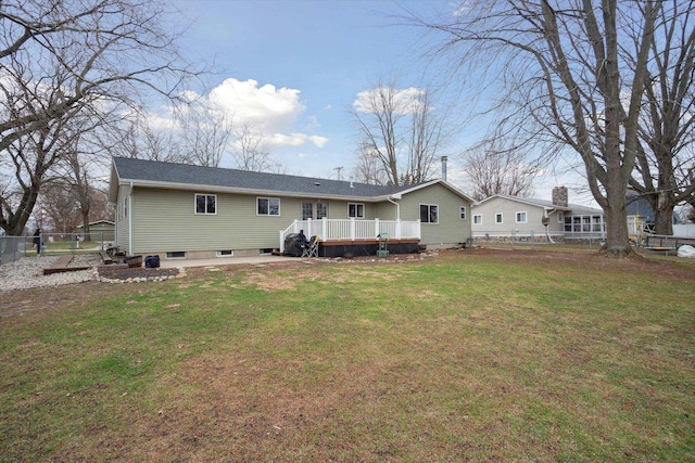 739 Gasper St, Chesaning, MI 48616 - rear view of property featuring a fenced backyard, a wooden deck, and a lawn
