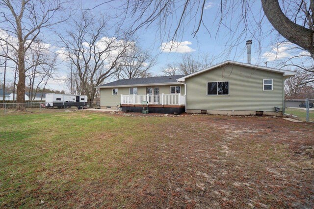 739 Gasper St, Chesaning, MI 48616 - rear view of property featuring a yard, crawl space, a wooden deck, and fence