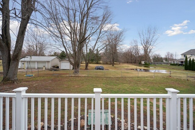 739 Gasper St, Chesaning, MI 48616 - view of yard with a detached garage and fence