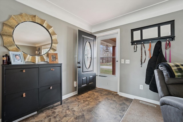 739 Gasper St, Chesaning, MI 48616 - foyer with stone finish floor, baseboards, and visible vents