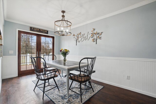 739 Gasper St, Chesaning, MI 48616 - dining area with a chandelier, french doors, crown molding, a wainscoted wall, and wood finished floors