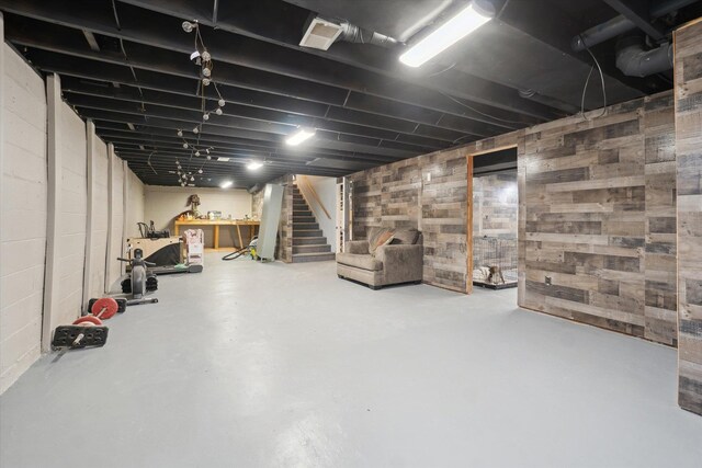 739 Gasper St, Chesaning, MI 48616 - unfinished basement featuring stairway and concrete block wall