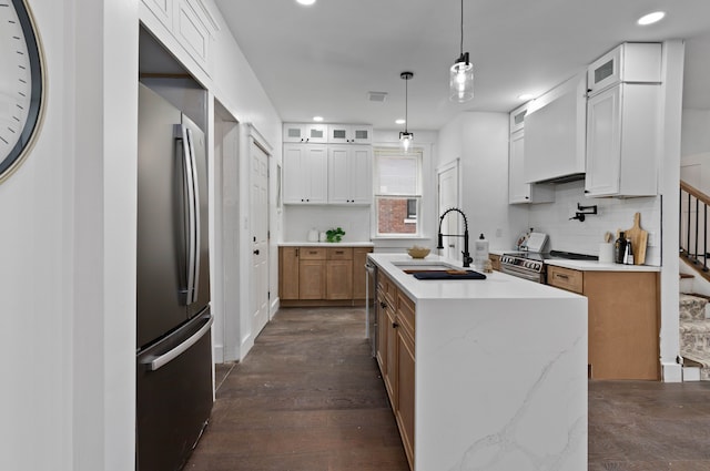 1651 Edison St, Detroit, MI 48206 - kitchen featuring a sink, appliances with stainless steel finishes, an island with sink, tasteful backsplash, and glass insert cabinets