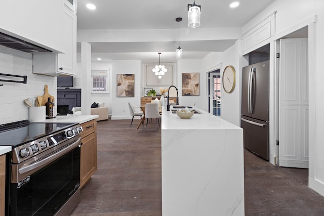 1651 Edison St, Detroit, MI 48206 - kitchen with appliances with stainless steel finishes, a sink, recessed lighting, decorative backsplash, and white cabinetry
