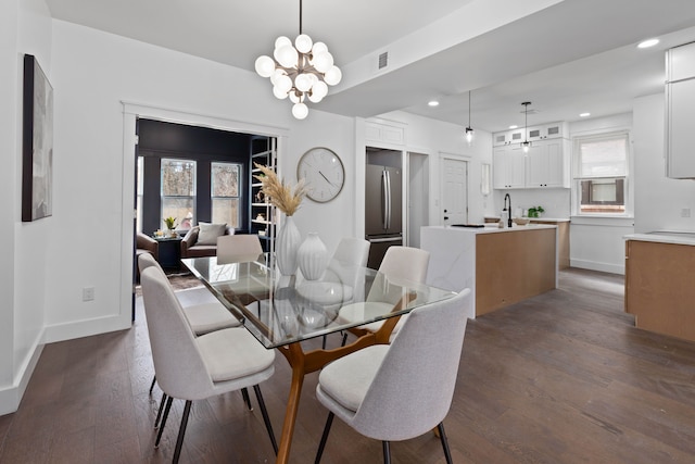1651 Edison St, Detroit, MI 48206 - dining space featuring a chandelier, recessed lighting, dark wood finished floors, and baseboards