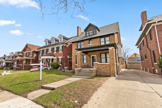 1651 Edison St, Detroit, MI 48206 - view of front of property with brick siding, a residential view, a chimney, and driveway