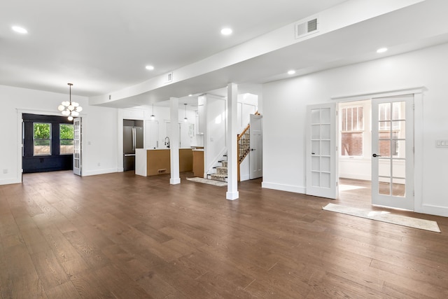 1651 Edison St, Detroit, MI 48206 - unfurnished living room featuring french doors, dark wood-type flooring, stairway, recessed lighting, and baseboards