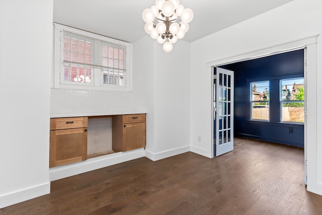 1651 Edison St, Detroit, MI 48206 - unfurnished dining area featuring a chandelier, dark wood finished floors, and baseboards