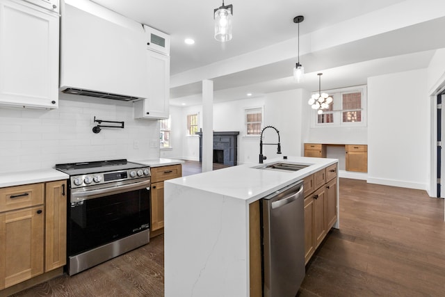 1651 Edison St, Detroit, MI 48206 - kitchen with appliances with stainless steel finishes, a sink, dark wood-style floors, tasteful backsplash, and baseboards