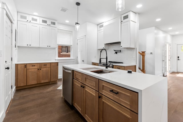 1651 Edison St, Detroit, MI 48206 - kitchen featuring a sink, dark wood-style floors, backsplash, stainless steel dishwasher, and white cabinetry