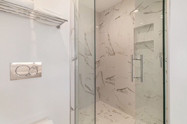 full bathroom with a marble finish shower