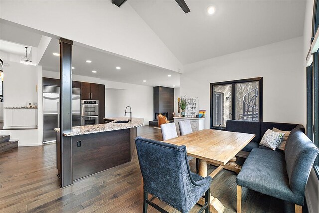 1194 Eagle Nest, Milford, MI 48381 - dining room featuring high vaulted ceiling, dark wood-style floors, and recessed lighting