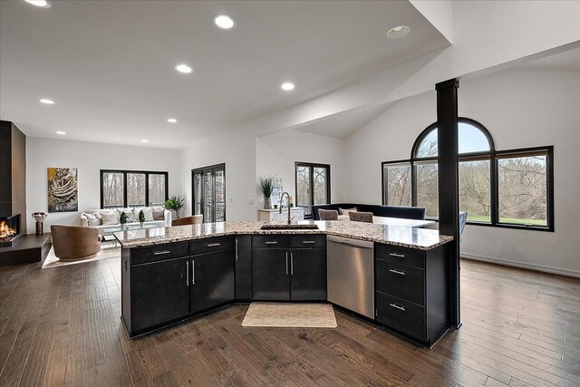 1194 Eagle Nest, Milford, MI 48381 - kitchen with dishwasher, a sink, dark cabinets, open floor plan, and recessed lighting