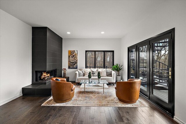 1194 Eagle Nest, Milford, MI 48381 - living room with healthy amount of natural light, hardwood / wood-style flooring, recessed lighting, and a tile fireplace