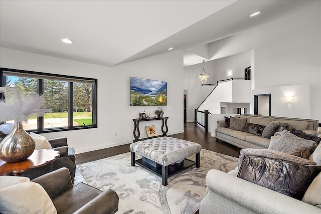 1194 Eagle Nest, Milford, MI 48381 - living area featuring wood finished floors, stairway, recessed lighting, baseboards, and high vaulted ceiling