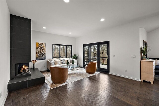 1194 Eagle Nest, Milford, MI 48381 - living area with wood finished floors, recessed lighting, a tile fireplace, and baseboards