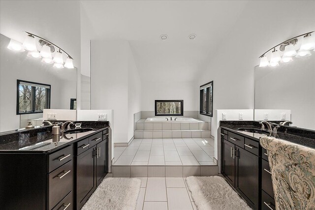 1194 Eagle Nest, Milford, MI 48381 - bathroom with high vaulted ceiling, two vanities, tile patterned flooring, and a garden tub