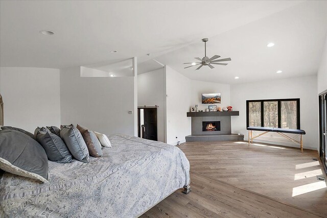 1194 Eagle Nest, Milford, MI 48381 - bedroom featuring wood finished floors, a fireplace, recessed lighting, lofted ceiling, and ceiling fan