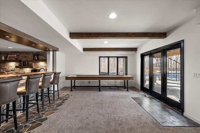 1194 Eagle Nest, Milford, MI 48381 - dining room with baseboards, carpet flooring, bar with sink, beamed ceiling, and recessed lighting