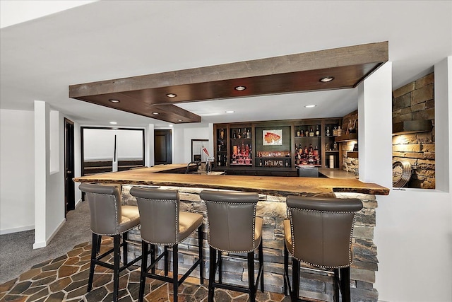 1194 Eagle Nest, Milford, MI 48381 - indoor wet bar featuring dark carpet, baseboards, and recessed lighting