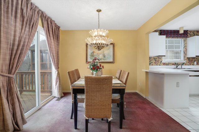 31052 Silverdale Dr, Novi, MI 48377 - tiled dining space with a notable chandelier, baseboards, a sink, and carpet floors