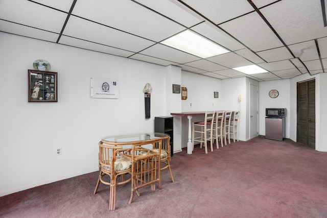 31052 Silverdale Dr, Novi, MI 48377 - dining room with a dry bar, baseboards, a drop ceiling, and carpet floors