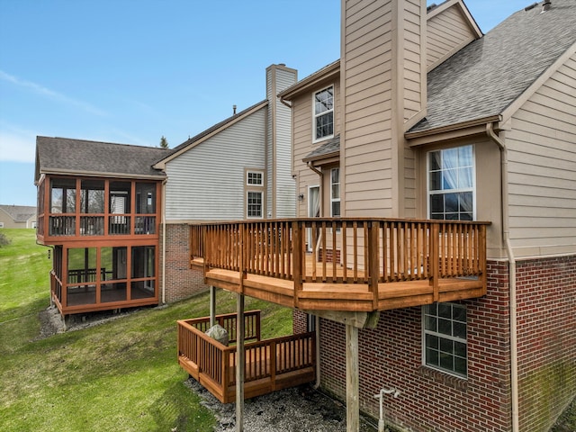 31052 Silverdale Dr, Novi, MI 48377 - wooden terrace featuring a sunroom and a lawn