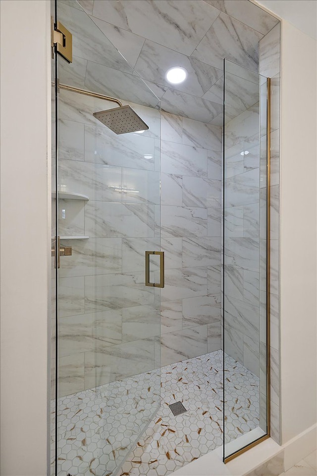 bathroom featuring a shower stall