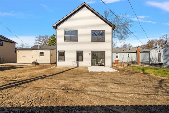 back of house featuring a patio and fence