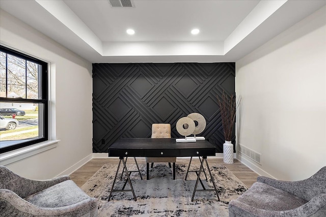 office space with light wood finished floors, baseboards, visible vents, and recessed lighting