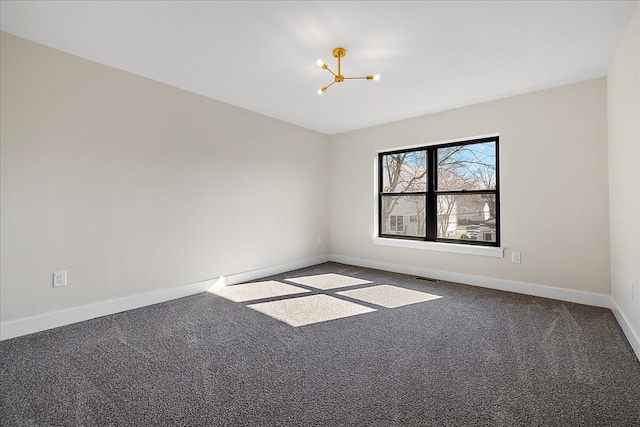 unfurnished room featuring a chandelier, carpet flooring, baseboards, and visible vents
