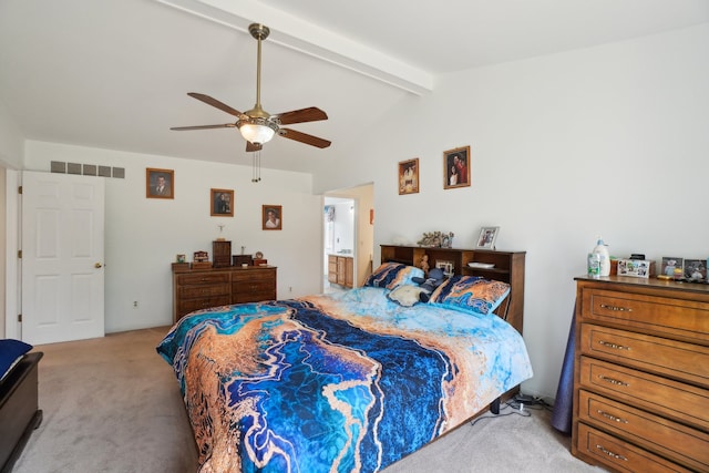 carpeted bedroom with visible vents, ceiling fan, ensuite bath, and lofted ceiling with beams
