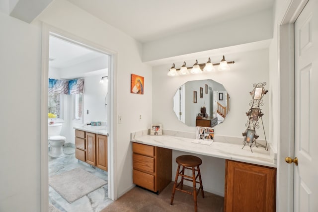bathroom featuring toilet and vanity