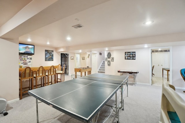 game room featuring light carpet, recessed lighting, and baseboards