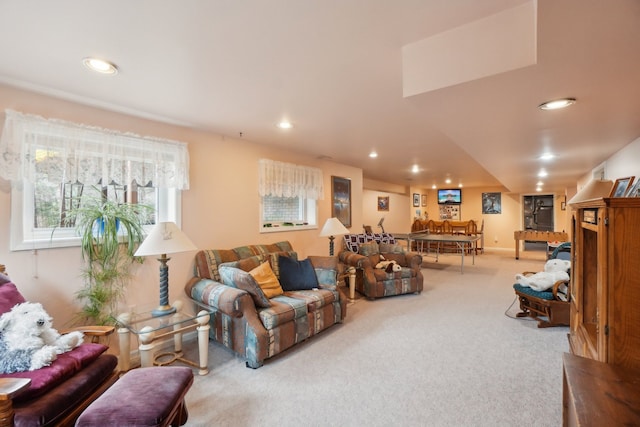 living area featuring recessed lighting and carpet