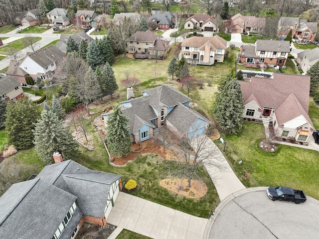 birds eye view of property with a residential view