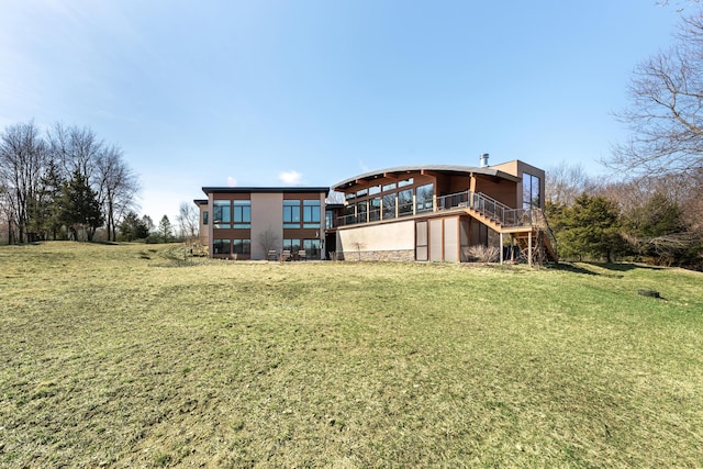 10485 Hadley Rd, Gregory, MI 48137 - rear view of house featuring a yard, stucco siding, and stairway