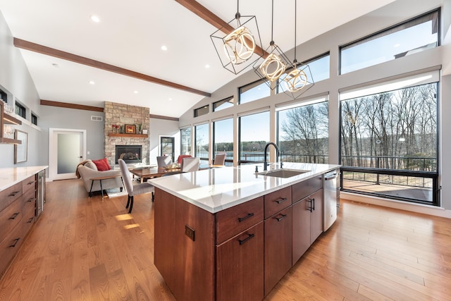 10485 Hadley Rd, Gregory, MI 48137 - kitchen with a sink, beam ceiling, stainless steel dishwasher, and light wood-type flooring