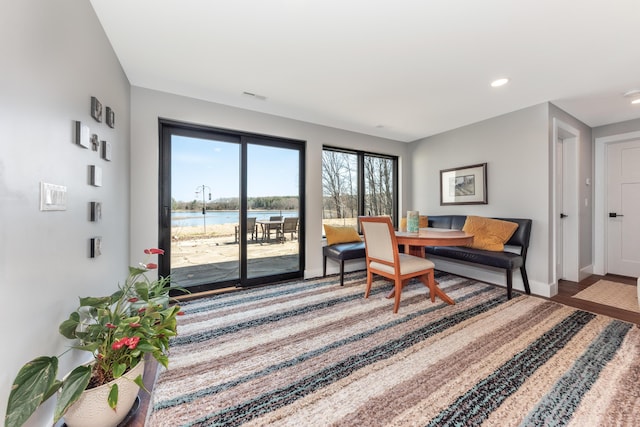 10485 Hadley Rd, Gregory, MI 48137 - interior space featuring visible vents, recessed lighting, a water view, wood finished floors, and baseboards