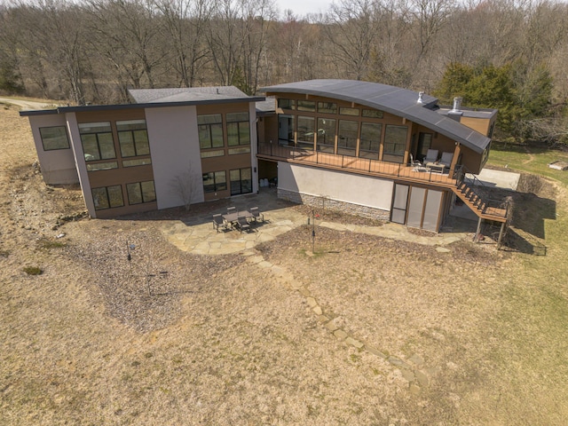 10485 Hadley Rd, Gregory, MI 48137 - back of house featuring a patio area, stairway, stucco siding, and a wooden deck