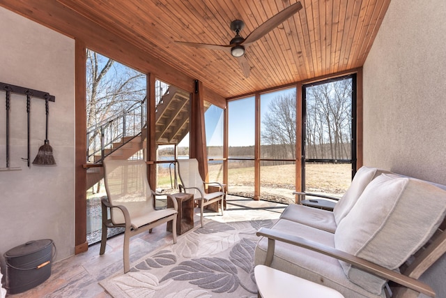 10485 Hadley Rd, Gregory, MI 48137 - sunroom / solarium with expansive windows, a textured wall, a ceiling fan, an outdoor hangout area, and wooden ceiling