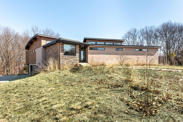 10485 Hadley Rd, Gregory, MI 48137 - view of front facade featuring stone siding