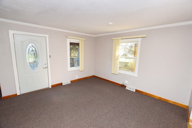 foyer entrance featuring visible vents, baseboards, and plenty of natural light
